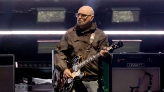 Oasis Guitarist Paul ‘Bonehead’ Arthurs Announces ‘Break’ From Tour Amid Prostate Cancer Diagnosis