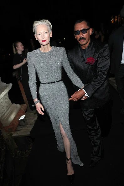 Tilda Swinton and Haider Ackermann attend the Tom Ford "Black Orchid Reserve" Private Event at Palazzo Contarini Polignac. (Photo by Jacopo Raule/Getty Images for Tom Ford)